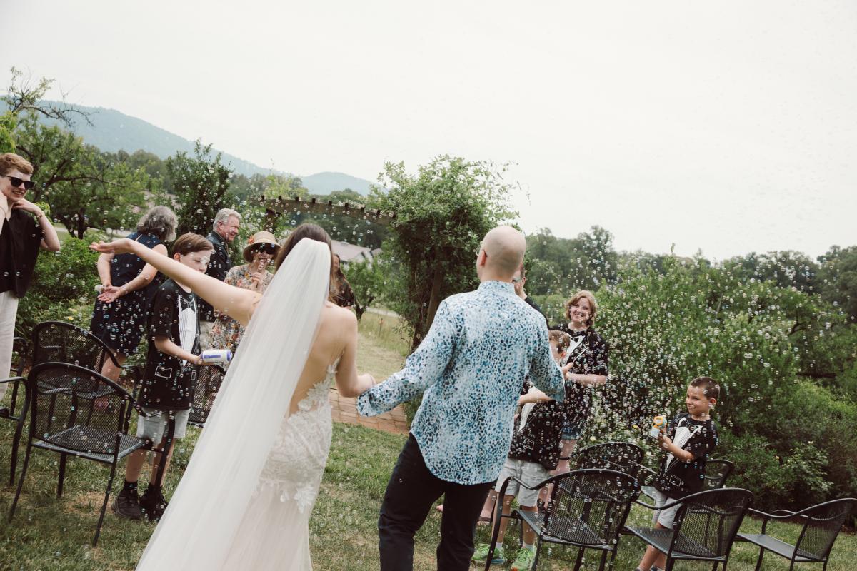 Day of I Do's Microwedding photo of bride Effie, taken by Amy Mitchell Photography. Microwedding with bubbles